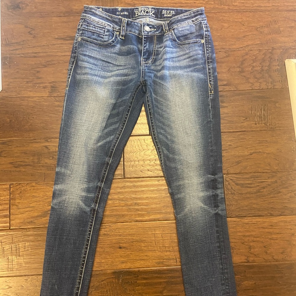 Excellent condition buckle black jeans . Stretchy